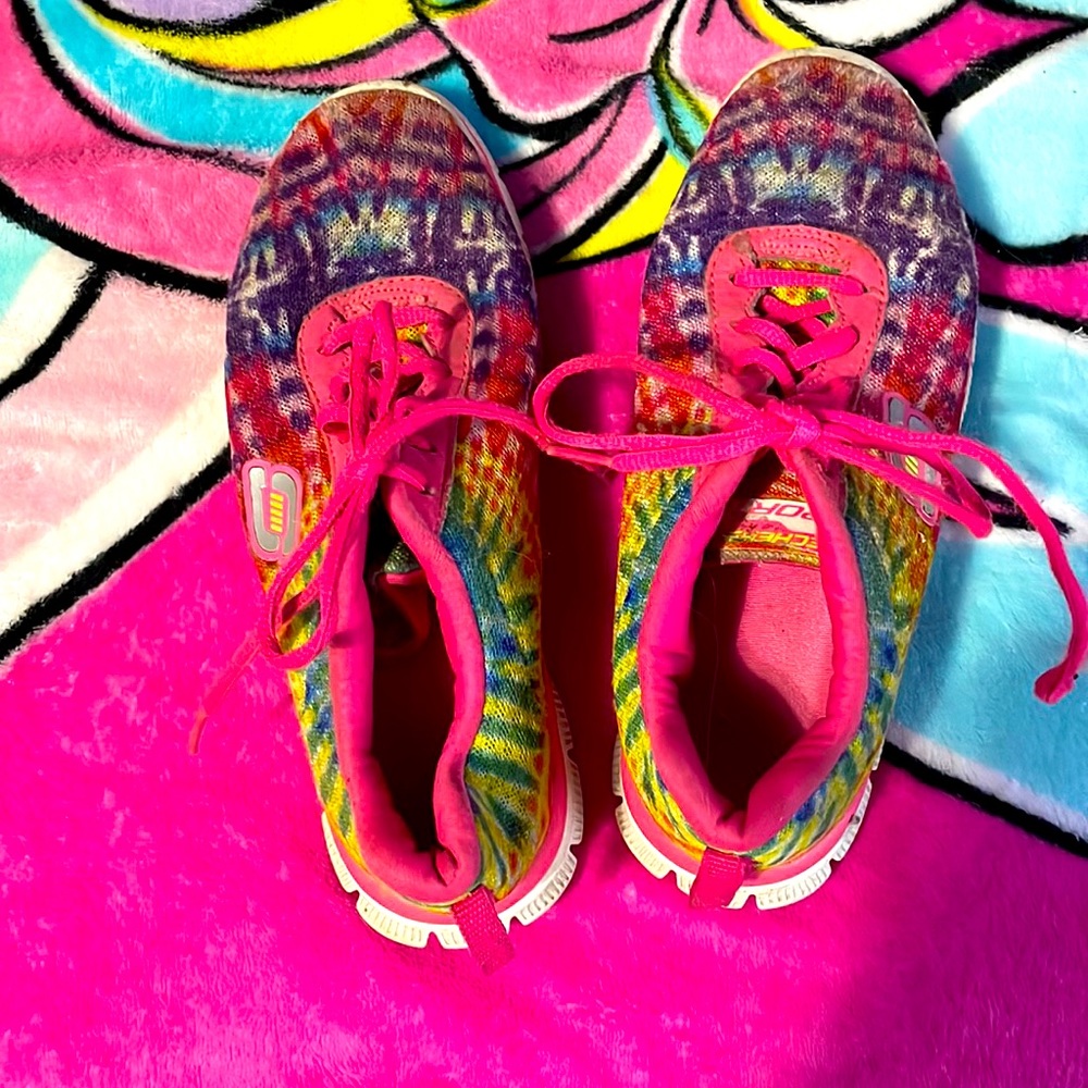 This is a pair of Skechers rainbow shoes. Barely warn. They are size 3 in kids.